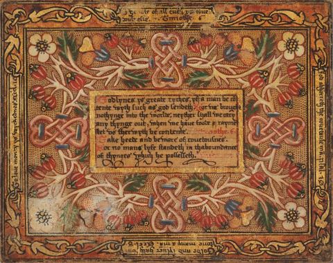Painting. Black and red text in a rectangular panel is surrounded by intricate designs of flowers and knots. More inscriptions line each of the four sides of the panel. The work is done in mostly caramel and golden brown with touches of strawberry red, pink, lapis blue, pine green, and ivory white.